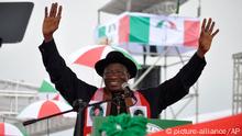 Nigeria President, Goodluck Jonathan, waves to his supporters during a political rally declaring his intention to run in next year's election in Abuja, Nigeria, Tuesday, Nov. 11, 2014, (AP Photo)
