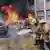 Пожарные тушат машины у здания парламента штата Герреро