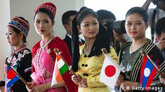 Women dressed in traditional costume greet the heads of state on the second day of the ASEAN summit on November 13, 2014 in Naypyidaw, Myanmar (Photo: Paula Bronstein/Getty Images)