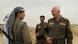 Iraqi Kurdish Commander Farkadin and PKK fighter Dersim during a rare moment of relaxation at the front in Matara, southwest of Kirkuk Iraqi Kurdish Commander Farkadin and PKK fighter Dersim during a rare moment of relaxation at the front in Matara, southwest of Kirkuk