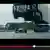 Youtube Screenshot - LKW springt über ein Formel 1 Auto