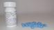 Blue Truvada pills next to a prescription bottle Blue Truvada pills next to a prescription bottle