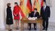 Queen Letizia talks to Daniela Schadt while King Felipe and President Gauck perform official duties. Queen Letizia talks to Daniela Schadt while King Felipe and President Gauck perform official duties.