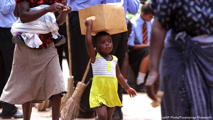 A young girl on the streets of Harare, Copyright: AP Photo/Tsvangirayi Mukwazhi