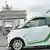 Photo: An electric car and the Brandenburg Gate in Berlin