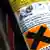 Detail of household aerosol carries the hazardous label, X