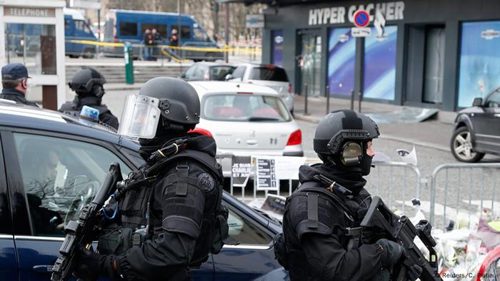Members of the special French RAID forces secure the area for the visit by Israel's Prime Minister Benjamin Netanyahu to the Hyper Cacher kosher supermarket January 12, 2015 near the Porte de Vincennes in Paris