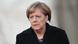 Chancellor Angela Merkel dressed in black, grimacing into the distance Chancellor Angela Merkel dressed in black, grimacing into the distance