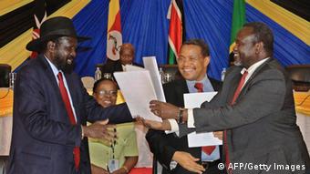 Salva Kiir and Riek Machar sign an agreement