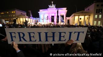 A banner reading 'Freedom' is seen during a Muslim community tolerance rally on January 13, 2015 in front of Brandenburg Gate in Berlin. Chancellor Angela Merkel and most of her cabinet are present at a Muslim community rally to promote tolerance, condemn the jihadist attacks in Paris against the Charlie Hebdo and send a rebuke to a growing German anti-Islamic 'Patriotic Europeans Against the Islamisation of the Occident' (PEGIDA) movement.