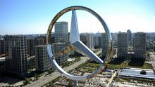 The giant logo of German vehicle maker Daimler's Mercedes-Benz sits on the top of its head office building in Beijing on October 11, 2010. Booming auto sales in China are leading manufacturers to step up production so fast that the government worries about 'blind investment' in the sector, were over capacities could be built up in a couple of years time, according to analysts. AFP PHOTO/GOU YIGE (Photo credit should read GOU YIGE/AFP/Getty Images)