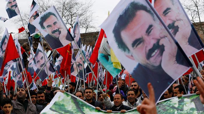 Demonstrators hold posters of Abdullah Ocalan in Istanbul