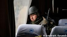 19.02.2015 * A Ukrainian serviceman who fought in Debaltseve is seen in a bus before leaving for his home, near Artemivsk February 19, 2015. Fighting raged in eastern Ukraine on Thursday despite European efforts to resurrect a still-born ceasefire, a day after pro-Russian separatists who spurned the truce forced thousands of government troops out of a strategic town. REUTERS/Gleb Garanich (UKRAINE - Tags: POLITICS CIVIL UNREST MILITARY CONFLICT TPX IMAGES OF THE DAY)