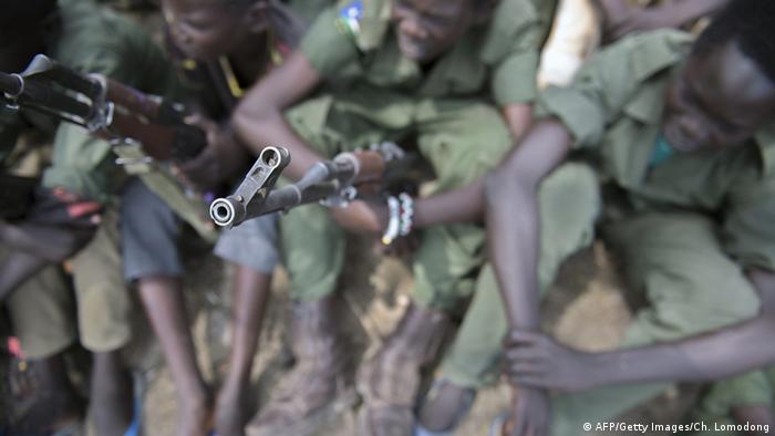 Young children soldiers attending a ceremony of the child soldiers disarmament, demobilisation and reintegration in Pibor, South Sudan.