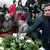 Opposition activist Ilya Yashin lays flowers at the site where Boris Nemtsov was murdered in central Moscow