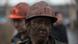 A miner waits for a bus after leaving Zasyadko coal mine in Donetsk March 4, 2015. A miner waits for a bus after leaving Zasyadko coal mine in Donetsk March 4, 2015.