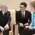 Angela Merkel with Emperor Akihito and a translator