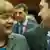 Меркель і Ципрас розмовляють під час саміту ЄС у Брюсселі 12 лютого 2015 року