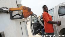 ARCHIV 2012 ***Bildunterschrift:A fuel attendant fills a tank at a gas station on Lagos' Ibadan highway on January 2, 2012 where new pump prices were implemented. Queues formed at petrol stations, protests broke out and unions threatened to paralyse Nigeria on January 2 over a deeply controversial measure that has more than doubled pump prices. The move announced on Sunday in Africa's most populous nation and largest oil producer immediately ends fuel subsidies on petrol, a policy that had held pump prices at 65 naira per litre ($0.40, 0.30 euros). AFP PHOTO / PIUS UTOMI EKPEI (Photo credit should read PIUS UTOMI EKPEI/AFP/Getty Images)