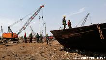 Workers prepare to dismantle a decommissioned ship at the Alang shipyard in the western Indian state of Gujarat, March 27, 2015.The European Union plans to impose strict new rules on how companies scrap old tankers and cruise liners, run aground and dismantled on beaches in South Asia. However the practice in India, Bangladesh and Pakistan, hazardous for humans and the environment, will still be hard to stop. European, Turkish and Chinese recyclers are set to benefit from the revamped standards. Depending on raw material prices, ship owners can make up to $500 per tonne of steel from an Indian yard, compared with $300 in China and just $150 in Europe. REUTERS/Amit Dave TPX IMAGES OF THE DAY PICTURE 6 OF 21 FOR WIDER IMAGE STORY 'CLEANING UP SHIPBREAKING' SEARCH 'SHIPBREAKING' FOR ALL 21 IMAGES