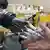 A human shakes a robotic hand