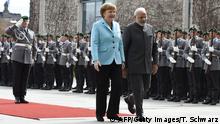 14.04.2015+++ German Chancellor Angela Merkel and Indian Prime Minister Narendra Modi inspect an honor guard before talks at the Chancellery in Berlin April 14, 2015. AFP PHOTO / TOBIAS SCHWARZ (Photo credit should read TOBIAS SCHWARZ/AFP/Getty Images)