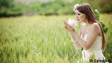 Beautiful bride posing in field Colourbox