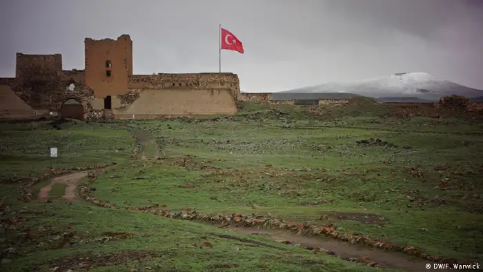 A Turkish flag flies from the walls of Ani