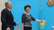 An electoral commission official invites Kazakh President Nursultan Nazarbayev (L) to cast his ballot at a polling station in Astana on April 26, 2015 An electoral commission official invites Kazakh President Nursultan Nazarbayev (L) to cast his ballot at a polling station in Astana on April 26, 2015