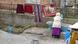 A woman does washing in the Roma settlement in Vidin A woman does washing in the Roma settlement in Vidin