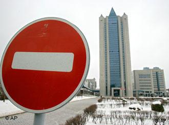 Gazprom headquarters behind a stop traffic sign