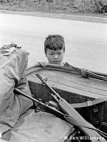 child next to boat copyright: K. Willaimson