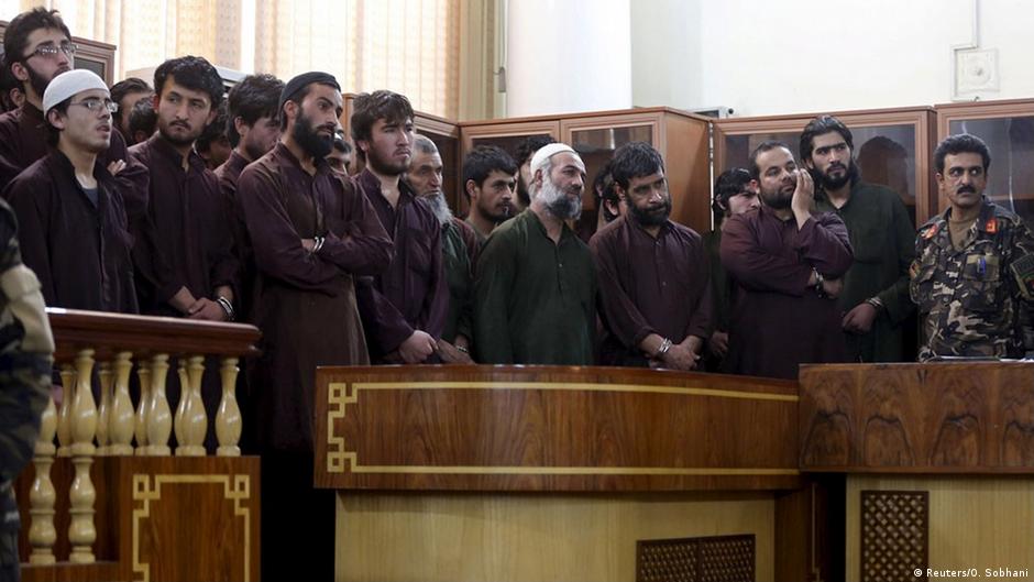 Afghan court tries suspects in woman's mob killing