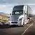 An autonomous Daimler truck drives through the Nevada desert.