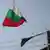 Българският национален флаг над един покрив