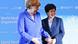 Bundeskanzlerin Merkel mit WHO-Chefin Chan (r.) auf der Weltgesundheitsversammlung Bundeskanzlerin Merkel mit WHO-Chefin Chan (r.) auf der Weltgesundheitsversammlung