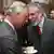 Prince Charles shakes hands with Gerry Adams