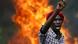 A protester gestures in front of a burning barricade during a protest against Burundi President Pierre Nkurunziza and his bid for a third term in Bujumbura, Burundi, May 21, 2015 (Photo: REUTERS/Goran Tomasevic) A protester gestures in front of a burning barricade during a protest against Burundi President Pierre Nkurunziza and his bid for a third term in Bujumbura, Burundi, May 21, 2015 (Photo: REUTERS/Goran Tomasevic)