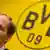 Thomas Tuchel listens to questions at the Borussia Dortmund press conference on Wednesday