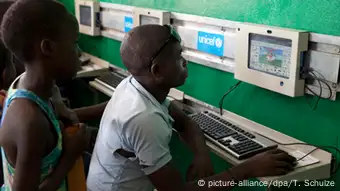 People in front of computers in a school in Bujumbura, Burundi