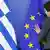 Сотрудница отдела протокола расправляет флаги Греции и Евросоюза