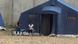 Two women sit outside a tent in a refugee camp near Rome train station Two women sit outside a tent in a refugee camp near Rome train station