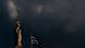 Greek goddess Athena against a dark sky Greek goddess Athena against a dark sky