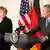 German Chancellor Angela Merkel and US President George W. Bush at a press conference
