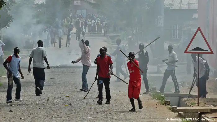 Imbonerakure militia seen amidst a crowd of smoke (Getty Images/AFP/C. de Souza)