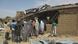 People gather at the site of suicide bomb attack at Redeem Christian church in Potiskum, Nigeria, Sunday, July 5, 2015. People gather at the site of suicide bomb attack at Redeem Christian church in Potiskum, Nigeria, Sunday, July 5, 2015.