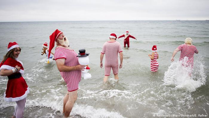 Santa Clauses swim in the ocean at the 2015 World Santa Claus Congress near Copenhagen, Copyright: Reuters/Scanpix Denmark/E. Refner