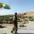 Боевик Рабочей партии Курдистана стоит на крыше здания на севере Ирака