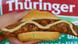 Thuringer Bratwurst with mustard in a bun Thuringer Bratwurst with mustard in a bun