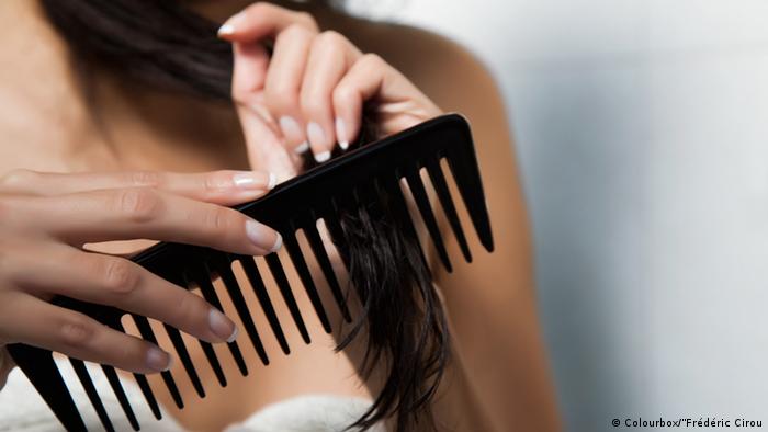 Woman combing hair comb icon image 